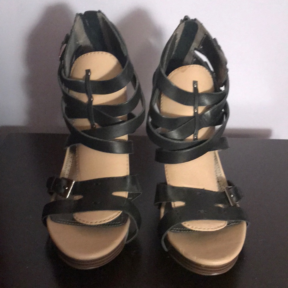 Tan and black buckle heels